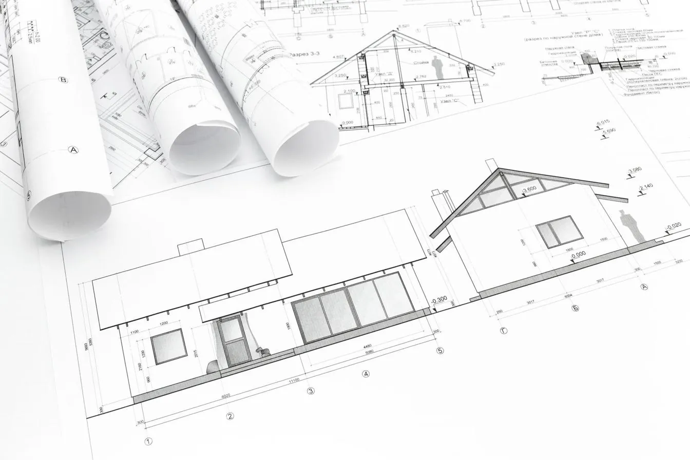 Professional engineer reviewing house plans and elevations